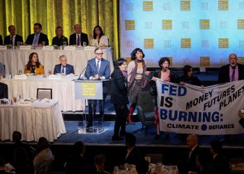 Fed Chair Powell escorted out of room as climate protesters interrupt start of speech