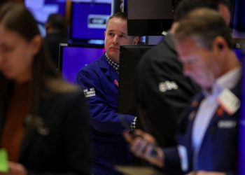 Nasdaq falls into correction territory as markets slip on disappointing tech earnings