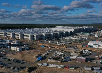 Tesla Stock Rises. It Raises Some Workers’ Pay. It’s Not Free of Union Pressure.