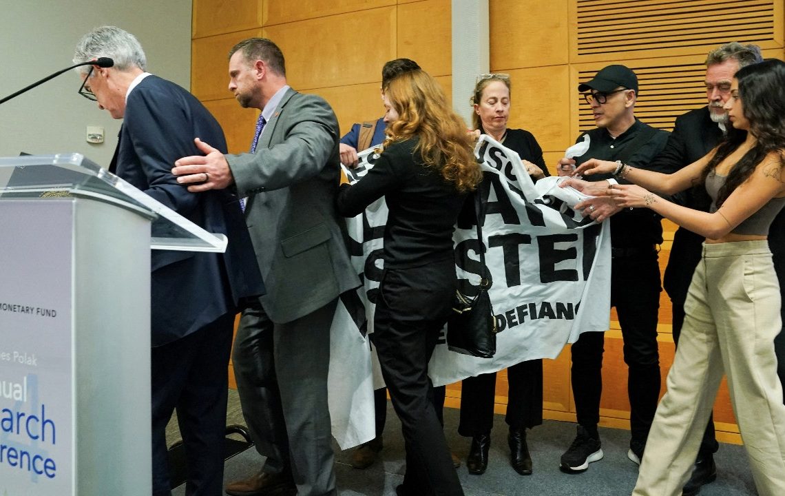 Fed Chair Powell rushed off stage after climate protesters interrupt speech