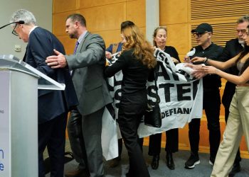 Fed Chair Powell rushed off stage after climate protesters interrupt speech