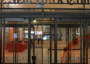 Anti-Israel protesters swarm Grand Central Terminal, splatter fake blood on New York Times building and set Israel flag ablaze