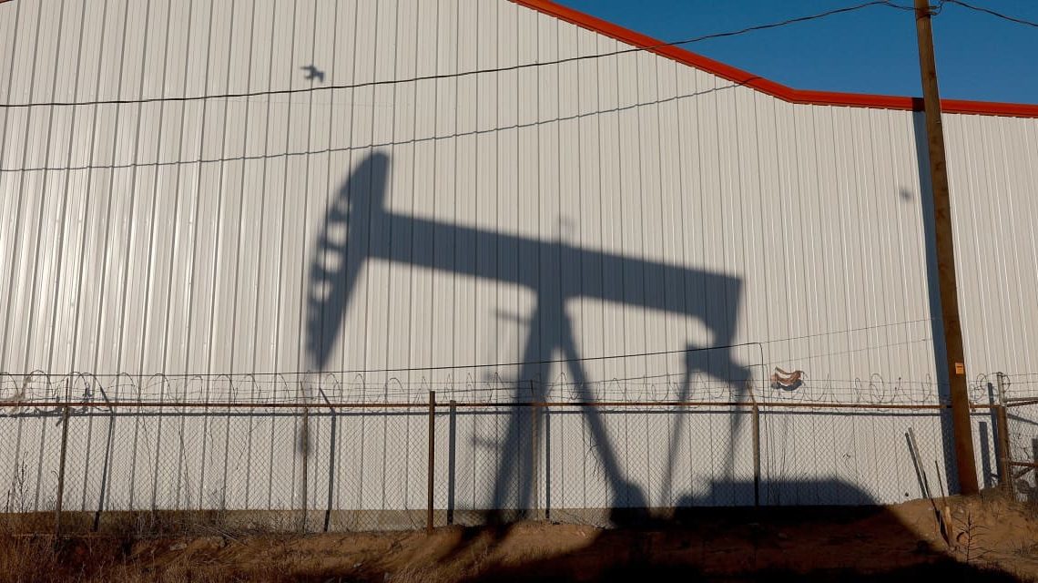 Oil futures settle at lowest since early July, pressured by demand worries and a rise in U.S. supplies