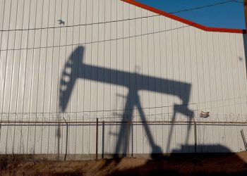 Oil futures settle at lowest since early July, pressured by demand worries and a rise in U.S. supplies