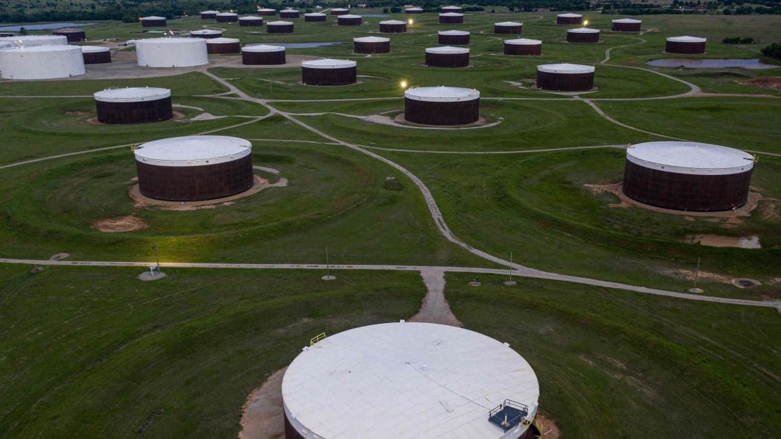 Oil prices finish lower as U.S. crude supplies mark a 2-week climb of more than 17 million barrels