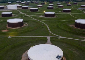 Oil prices finish lower as U.S. crude supplies mark a 2-week climb of more than 17 million barrels