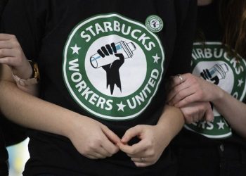 Starbucks is handing out pay hikes and new benefits. But some are only for non-union workers