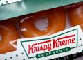 Krispy Kreme is giving away free boxes of donuts, but there’s a trick to getting them