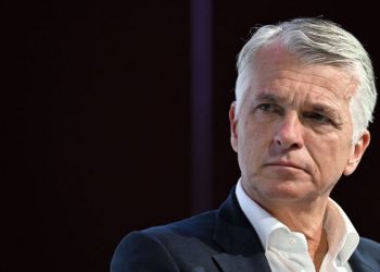 He’s leading the biggest banking deal in history. Failure is not an option