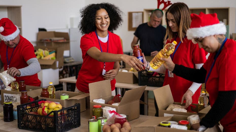 Holiday charity volunteers collect food