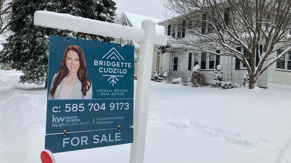 For sale sign in the snow