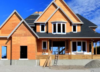 Sales of new homes surged in December as mortgage rates dipped below 7%