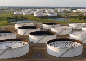 Oil futures end lower as U.S. crude supplies post an unexpected gain and product stocks jump