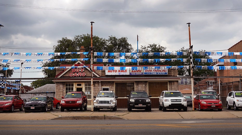 Used cars are offered for sale at a dealership on July 11, 2023, in Chicago, Illinois.