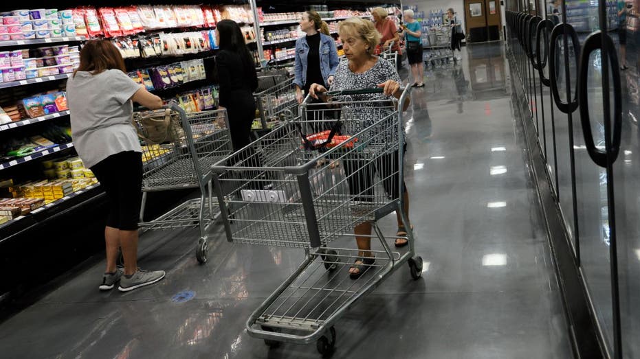 shoppers in grocery store