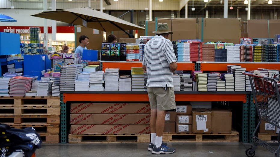 customer looking at books at costco