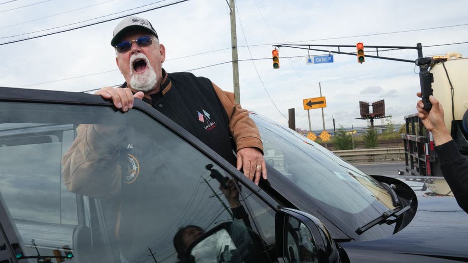 Harold Daggett yelling from a vehicle