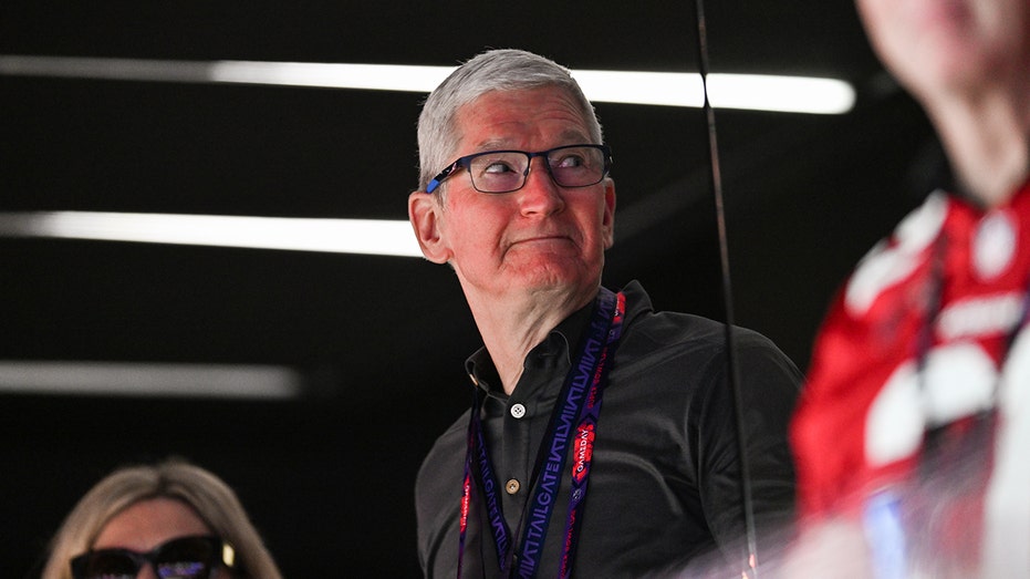 Tim Cook wearing a lanyard at the Super Bowl