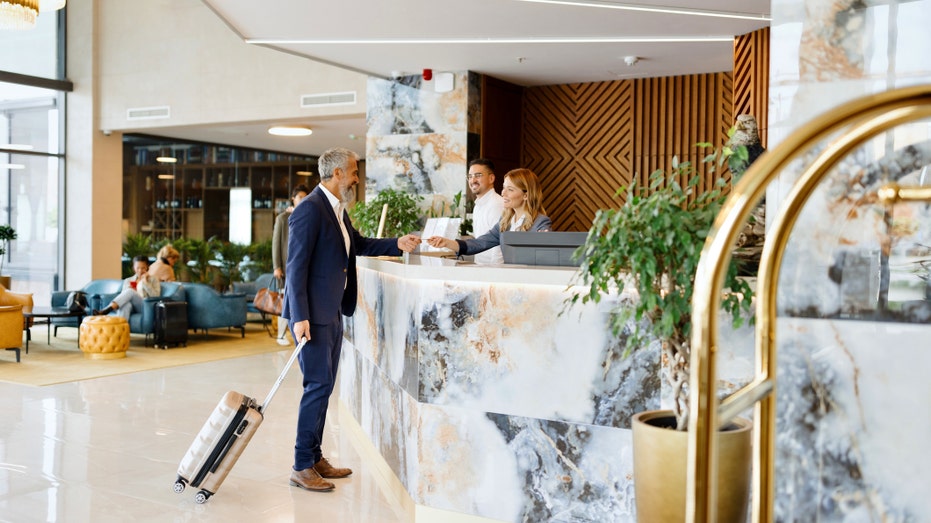 Man checking into a hotel