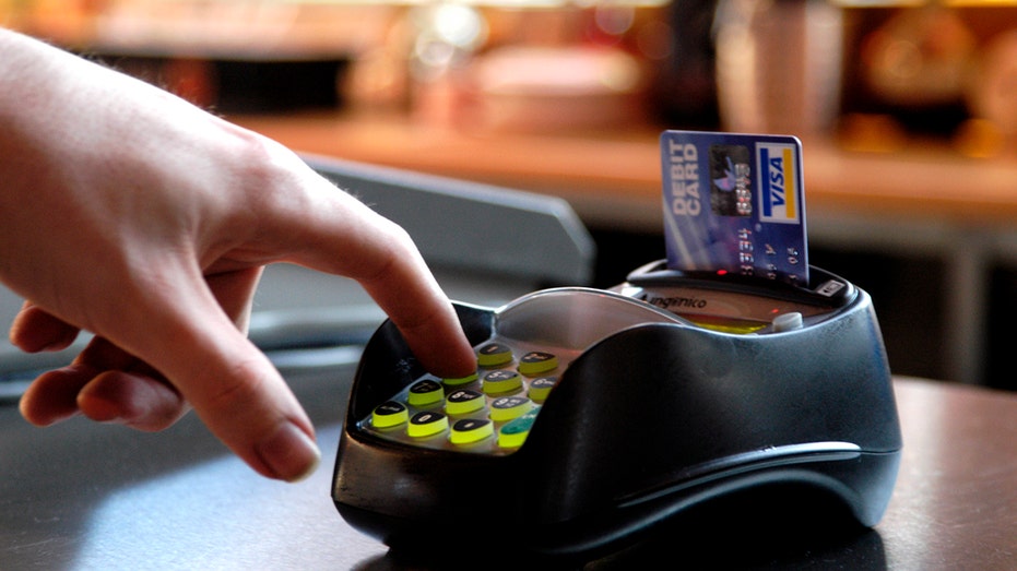 Someone paying with a Visa card.