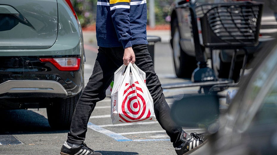 A shopper carries a shopping bag outside a Target store in Emeryville, California.