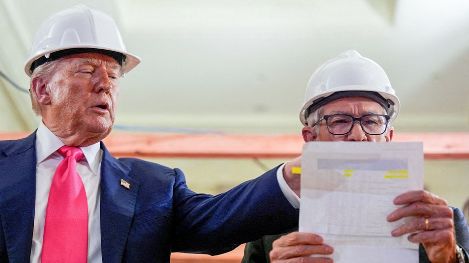 Powell fact checks numbers on a document after Trump makes a claim about project costs