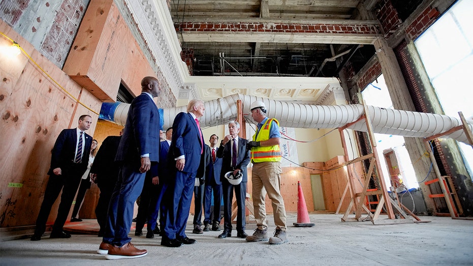 President Donald Trump tours renovations at the Federal Reserve building with Chairman Jerome Powell and Sen. Tim Scott